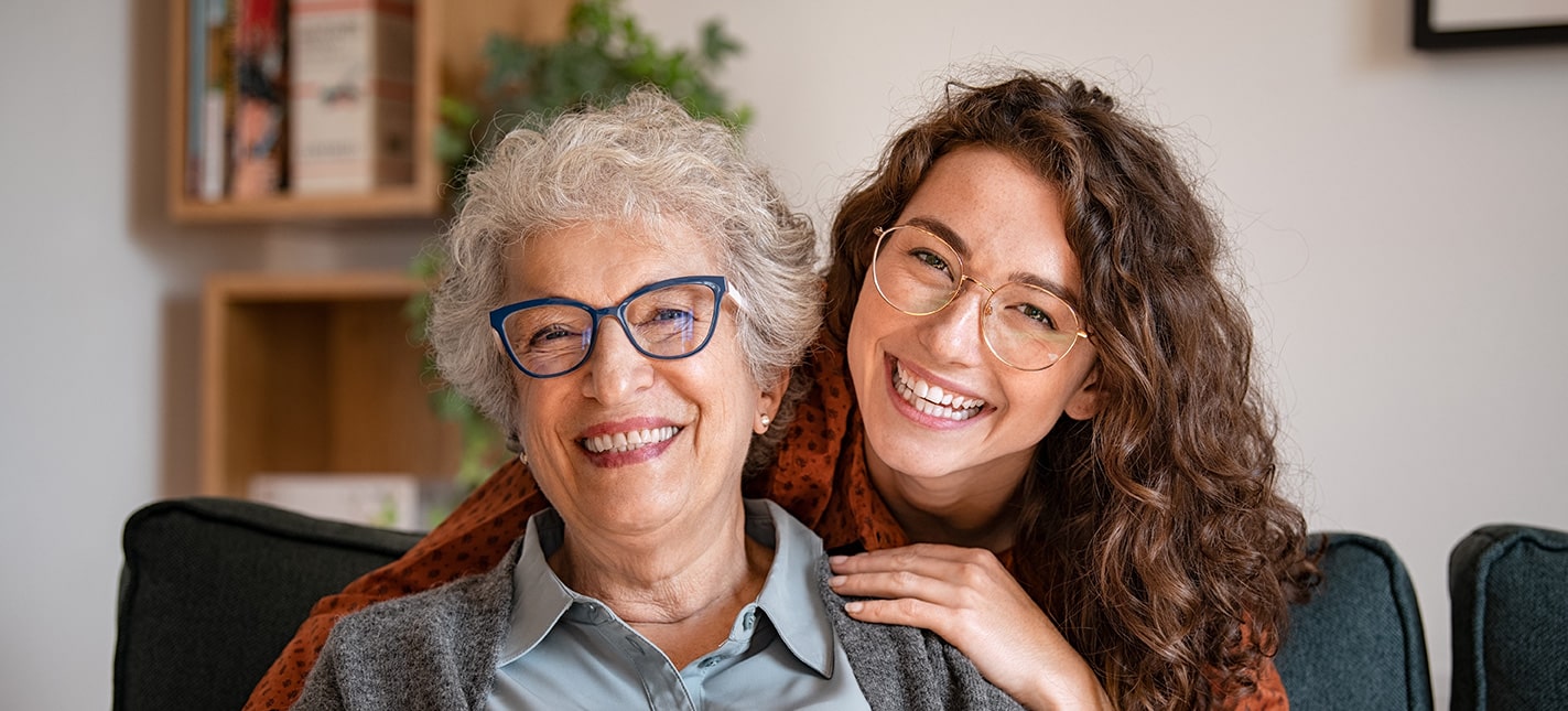 Grandmother and granddaughter smiling