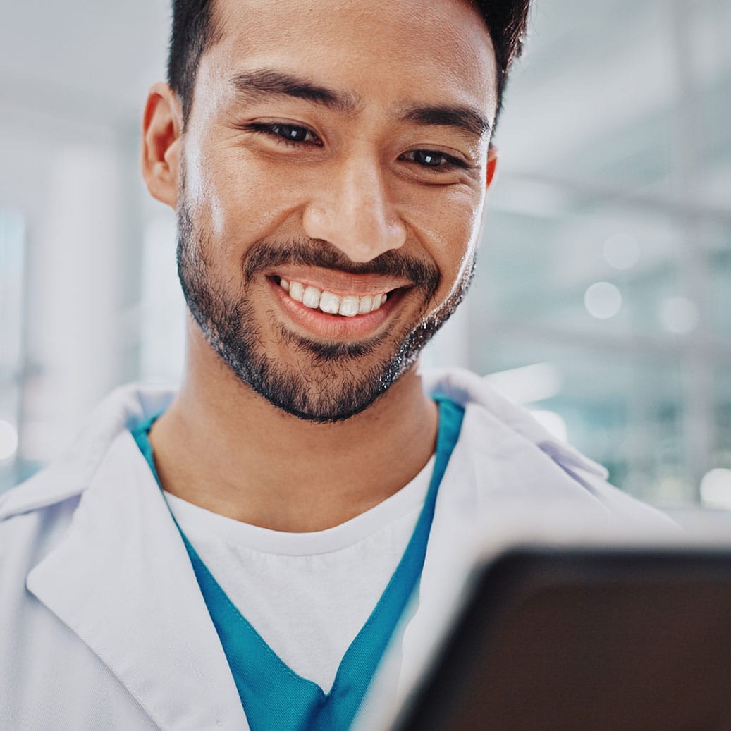 Provider smiling at tablet